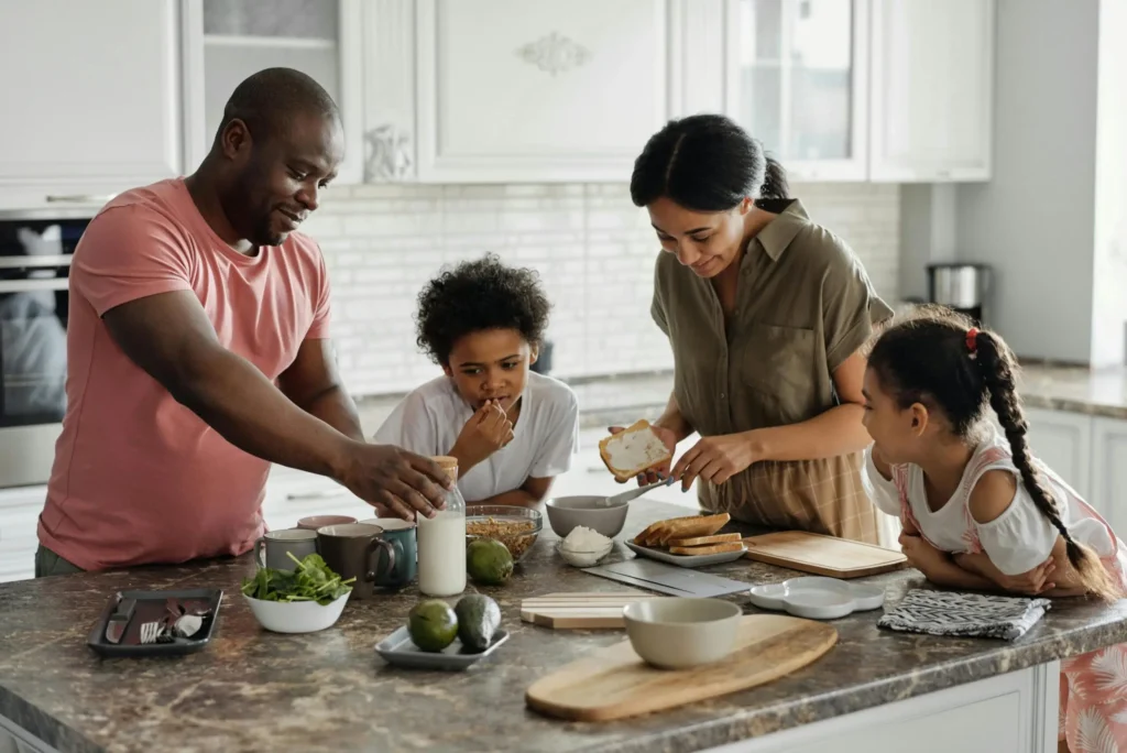 Family gathered around kitchen center island